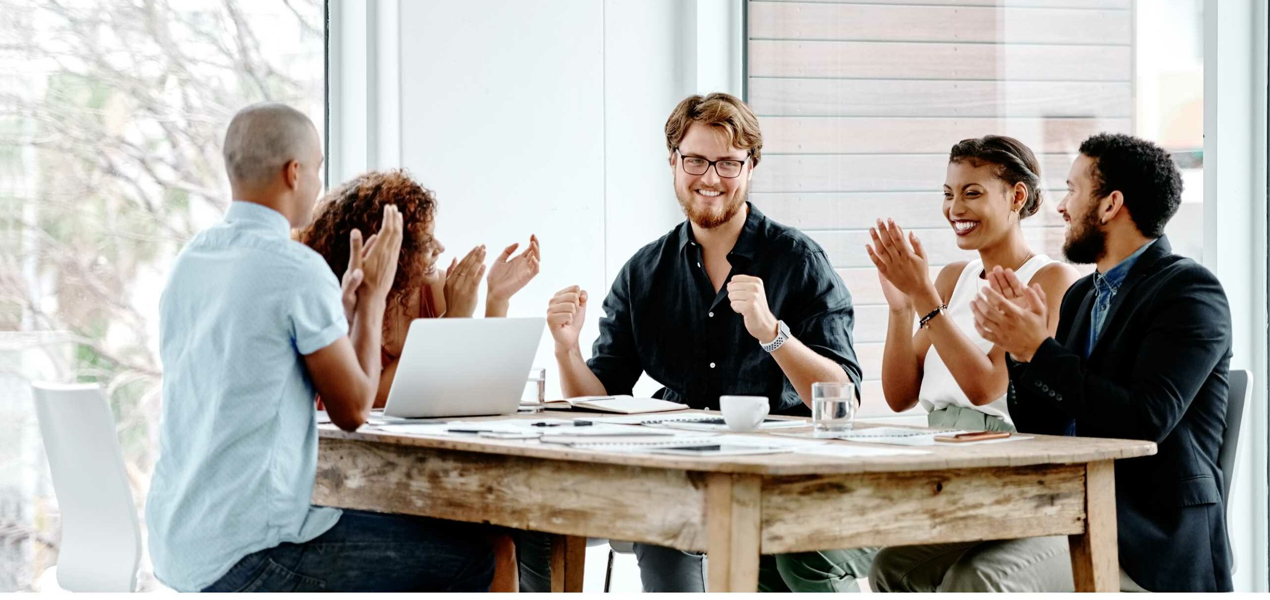 people appreciating a man by clapping