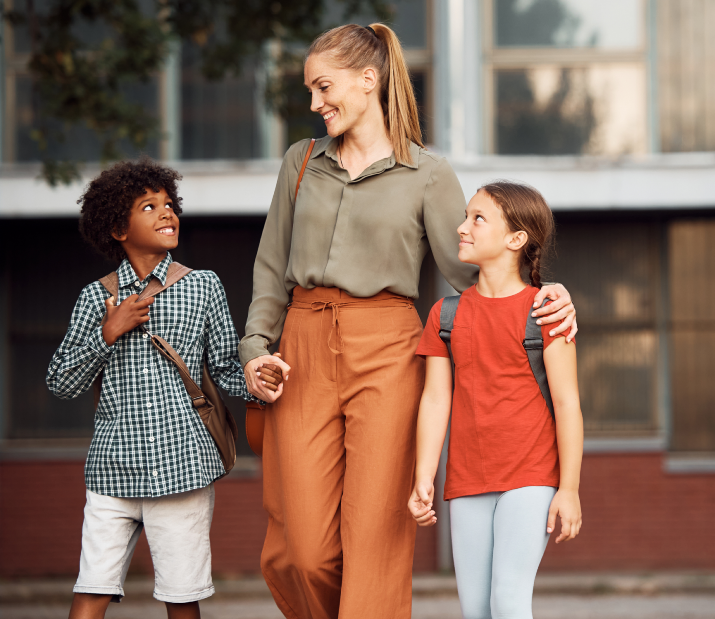 Teacher walking with young students