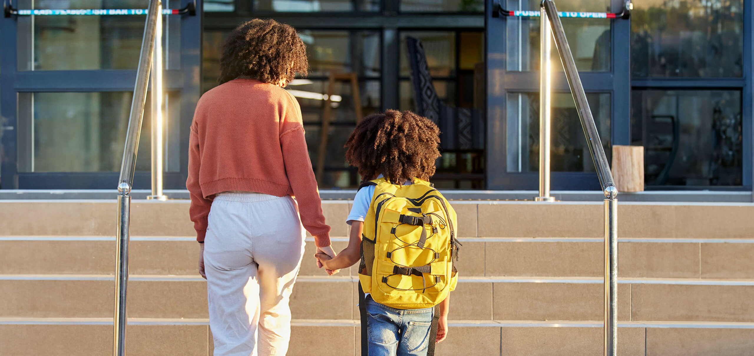 mother dropping his son to school