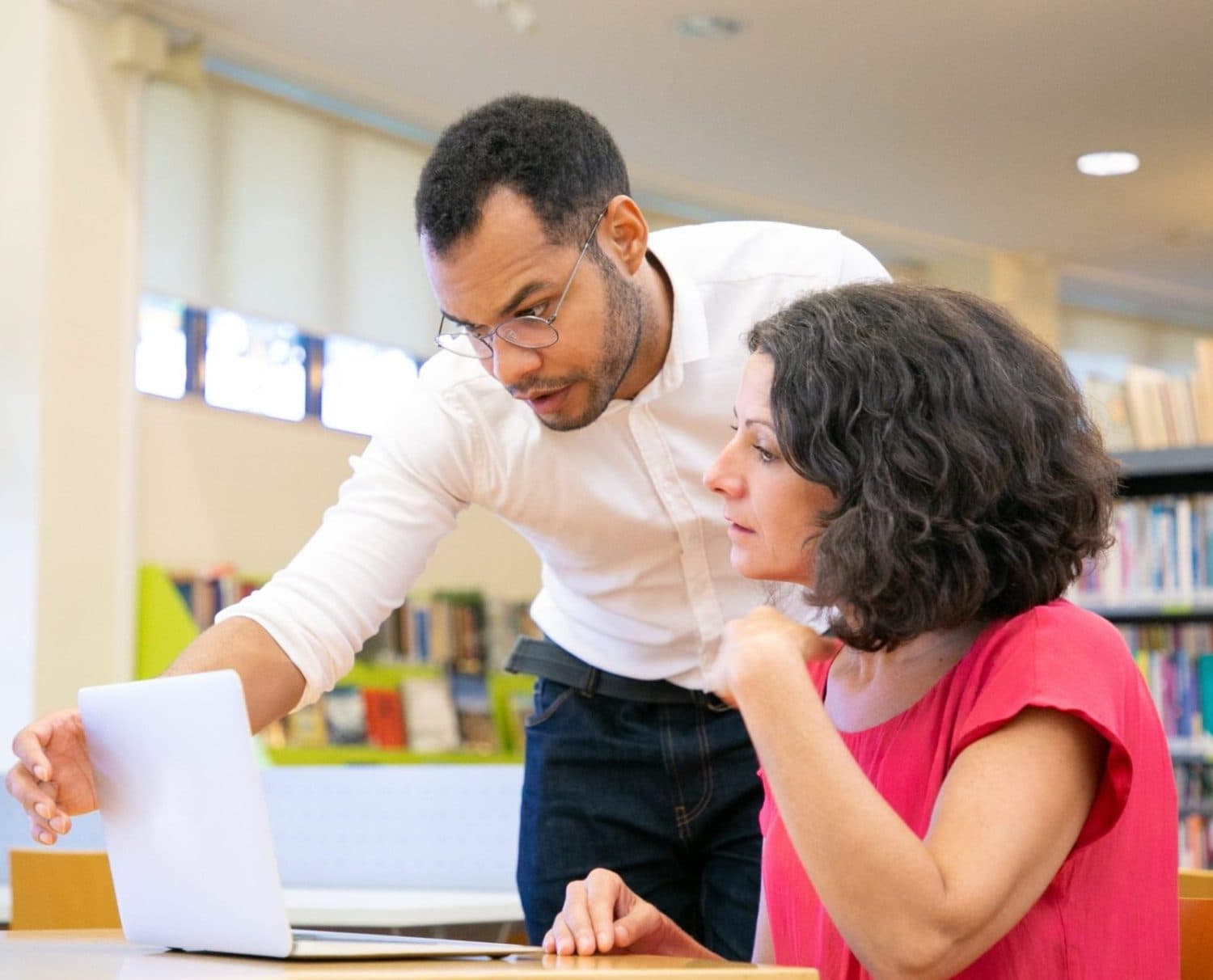 Man and woman collaborating on laptop