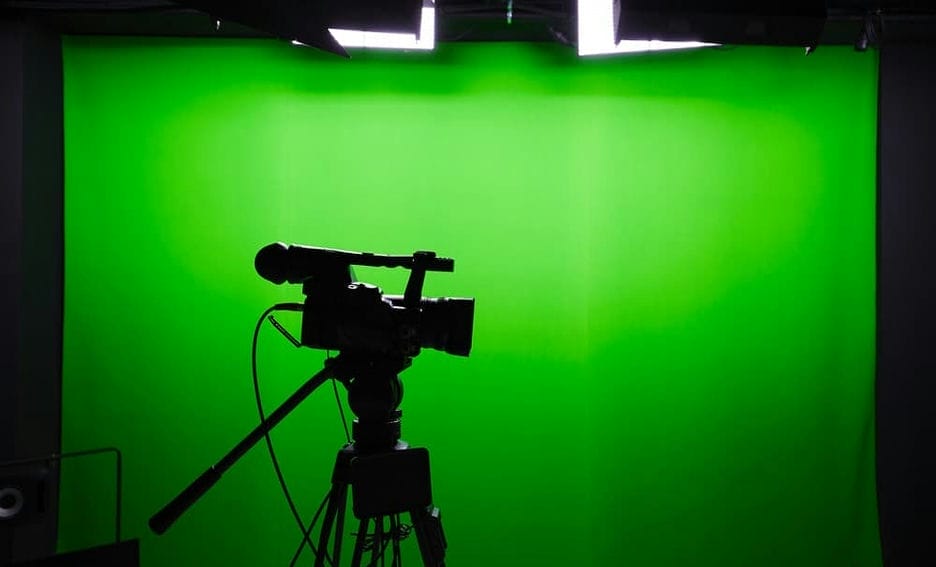 Movie filming set with green screen and camera