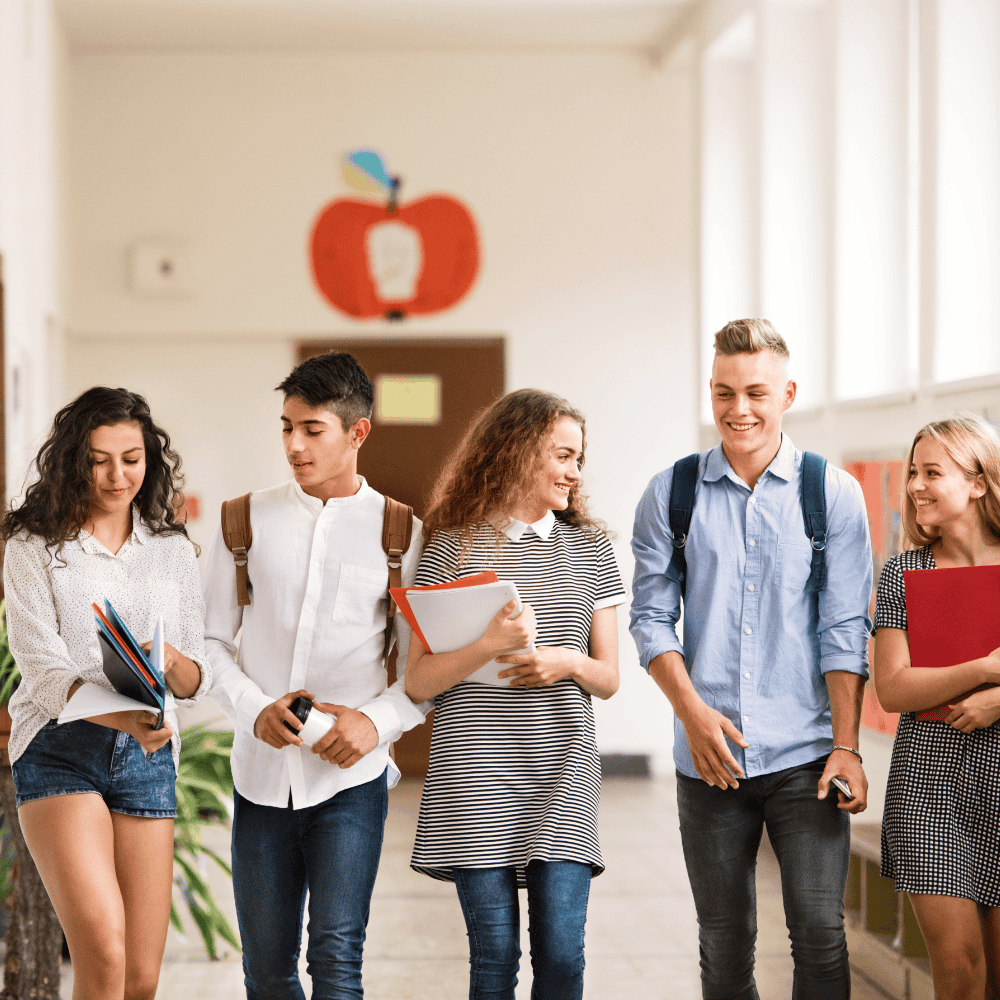 Group of students walking in school halls