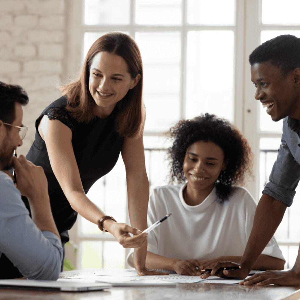 Diverse school staff conversing together